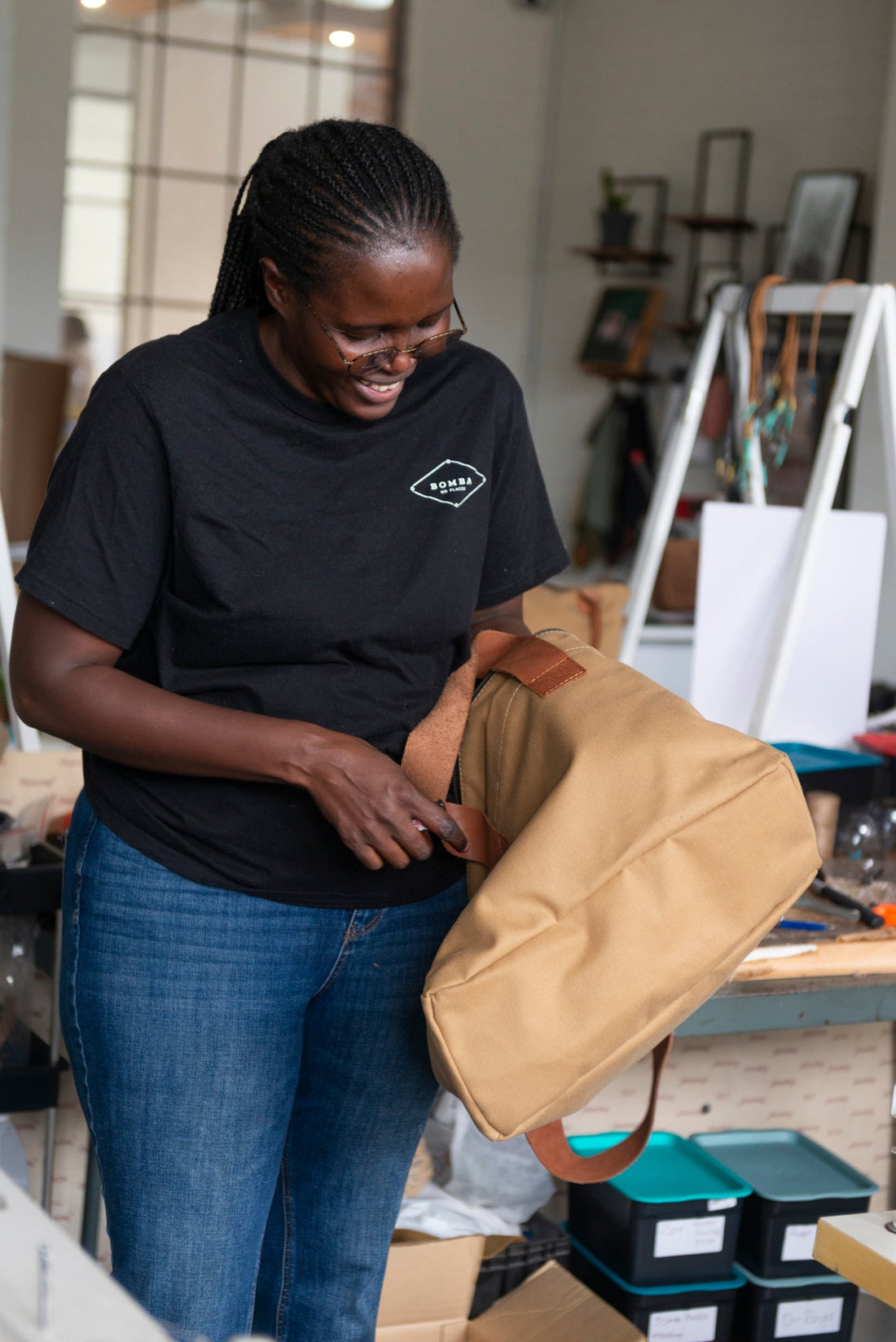 Bongi hand-stitching a canvas bag in the Bomba Bags studio, Salt Circle Arcade, Cape Town
