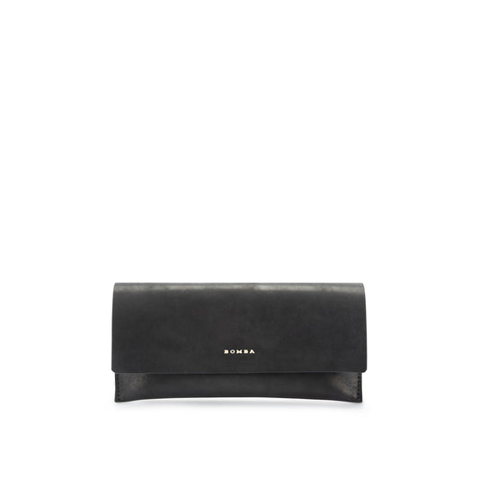 Black leather sunglasses pouch with a foldover flap and gold Bomba logo, handmade in Cape Town